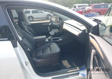 2023 Tesla Model Y from USA, damaged, VIN 7SAYGDEE1PF647564